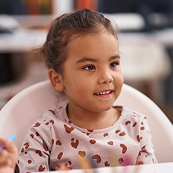 Child enjoying learning at Playful Scholars preschool in Midland MI, where curiosity and friendships bloom.