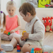 Young toddler exploring play-based learning at Playful Scholars in Midland, MI.